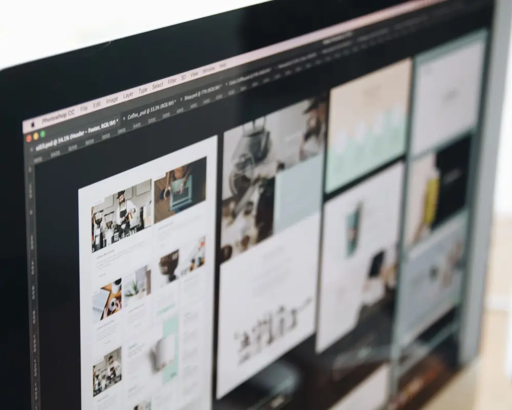 A monitor showing a website design